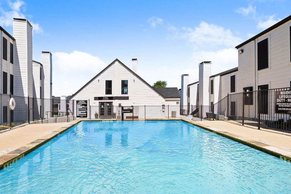 the swimming pool at the conclusion of a residence hall with a large resort style pool