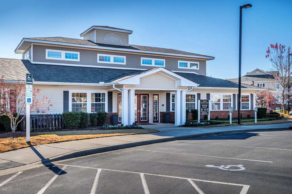 an empty parking lot in front of a house