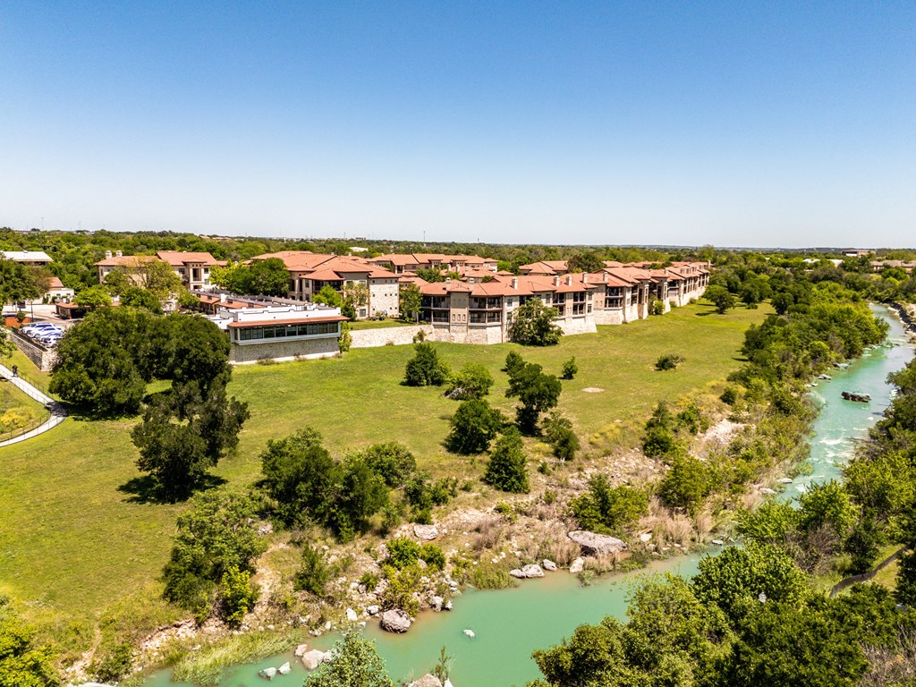 an aerial view of the resort and river