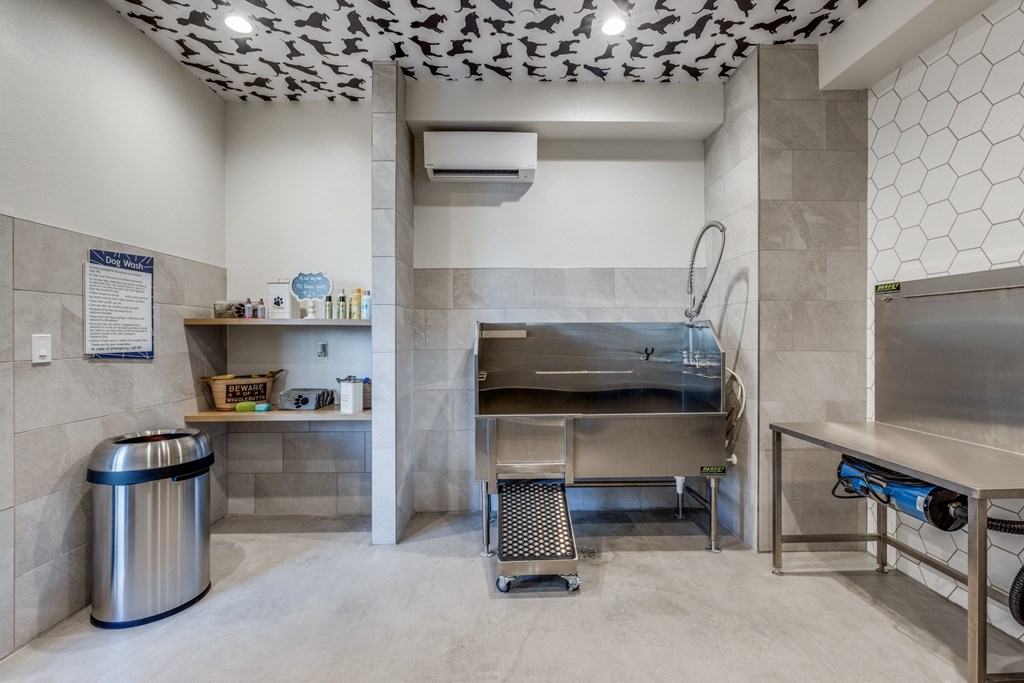 a commercial kitchen with a stainless steel stove and a sink