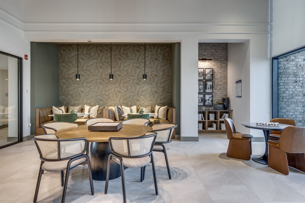 a dining room with a table and chairs and a living room