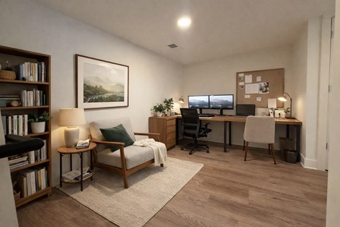 A room with a desk, chair, and bookshelf.