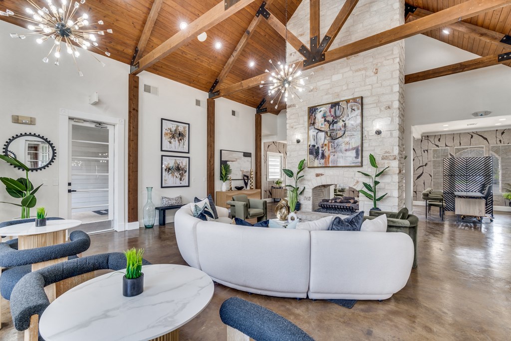 a living room with a white couch and a fireplace