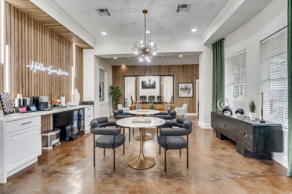 a dining room with a table and chairs and a living room