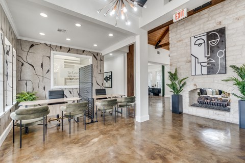 a dining room with a table and chairs and a fireplace