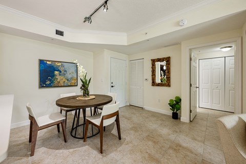 a dining room with a table and chairs
