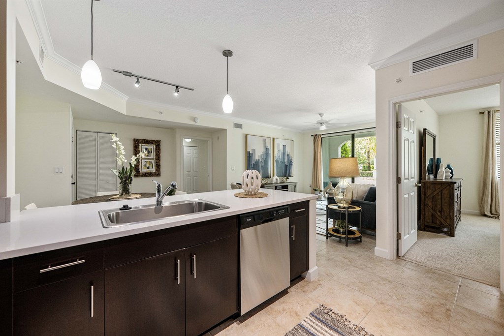 an open kitchen and living room with a dining room in the background