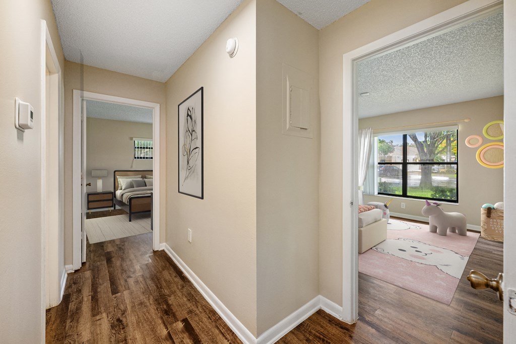 an open living room and dining room with a large window