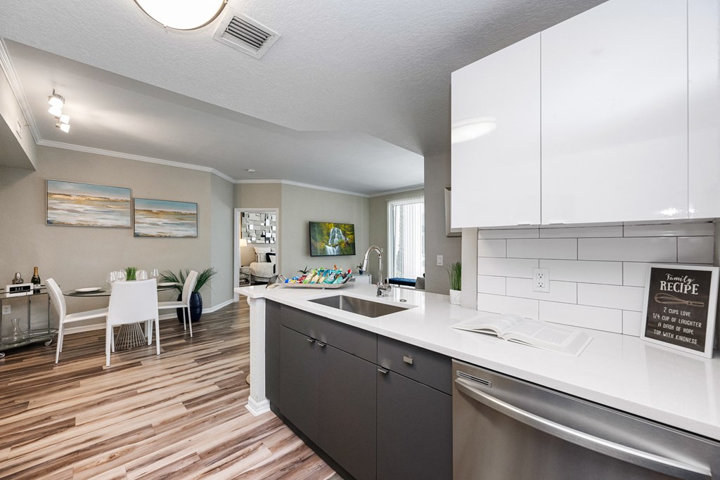 A kitchen with a white counter and a sign that says "RECIPE".