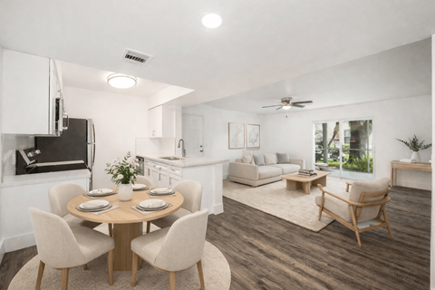 A modern dining room with a wooden table and chairs.