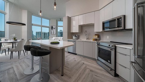 an open kitchen and dining area with a table and chairs