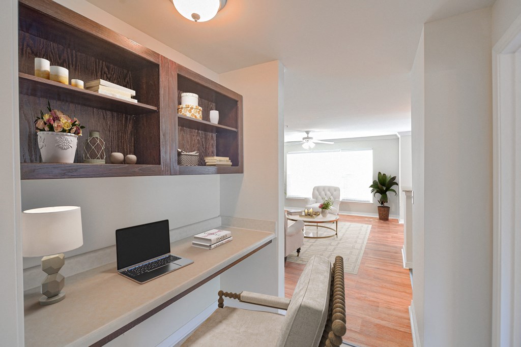 a home office with a laptop on a desk