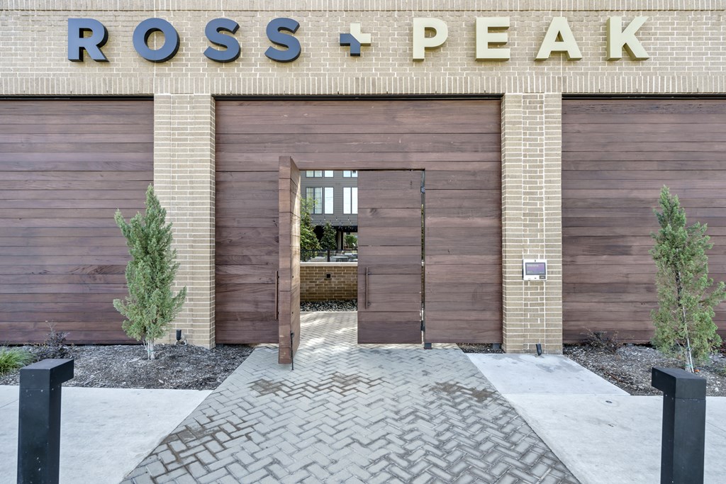 A building with a sign that says Ross + Peak.