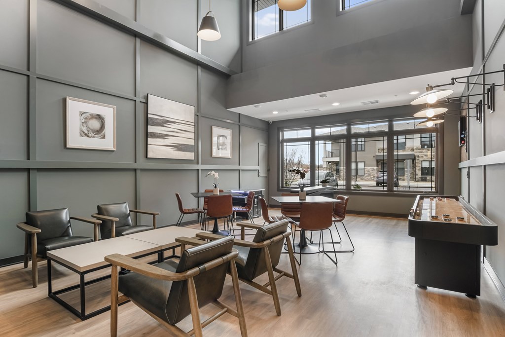 A modern office space with wooden floors and furniture.