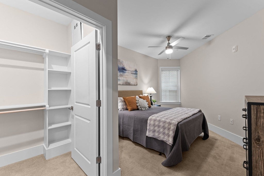 a bedroom with a bed and a closet