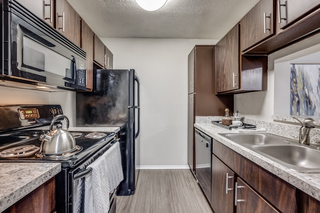our apartments have a modern kitchen with stainless steel appliances and wooden cabinets