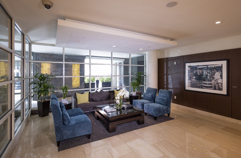 A living room with a large window and a coffee table.