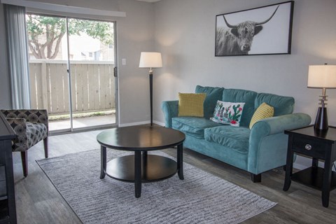 a living room with a couch and a table