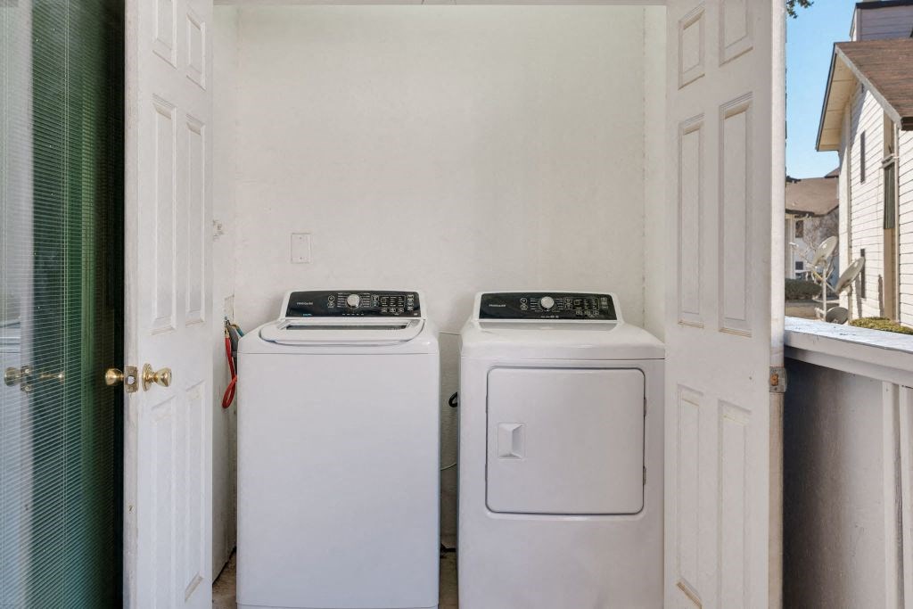 a washer and dryer in a laundry room with a door