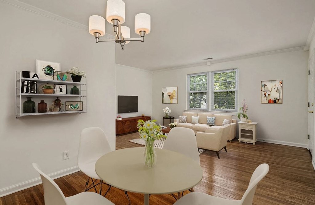 a dining room with a table and chairs and a living room