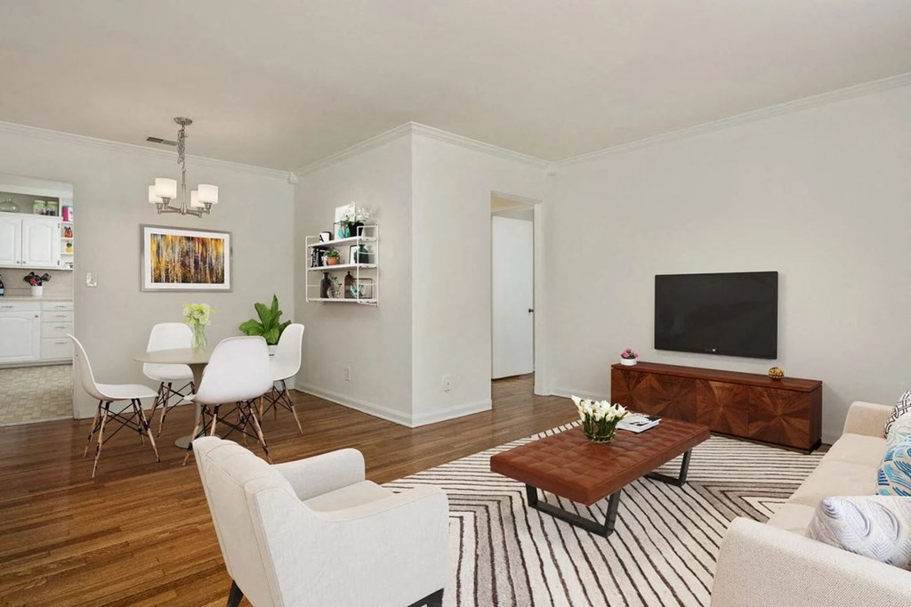 a living room with a couch and a table and a television