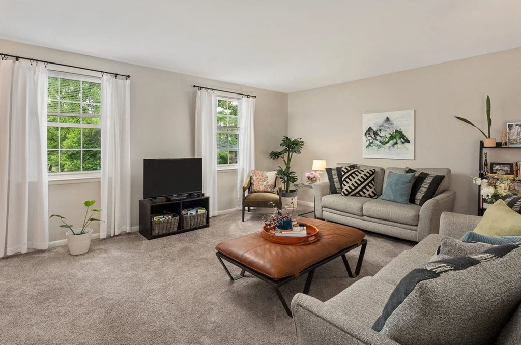 a living room with couches and a table