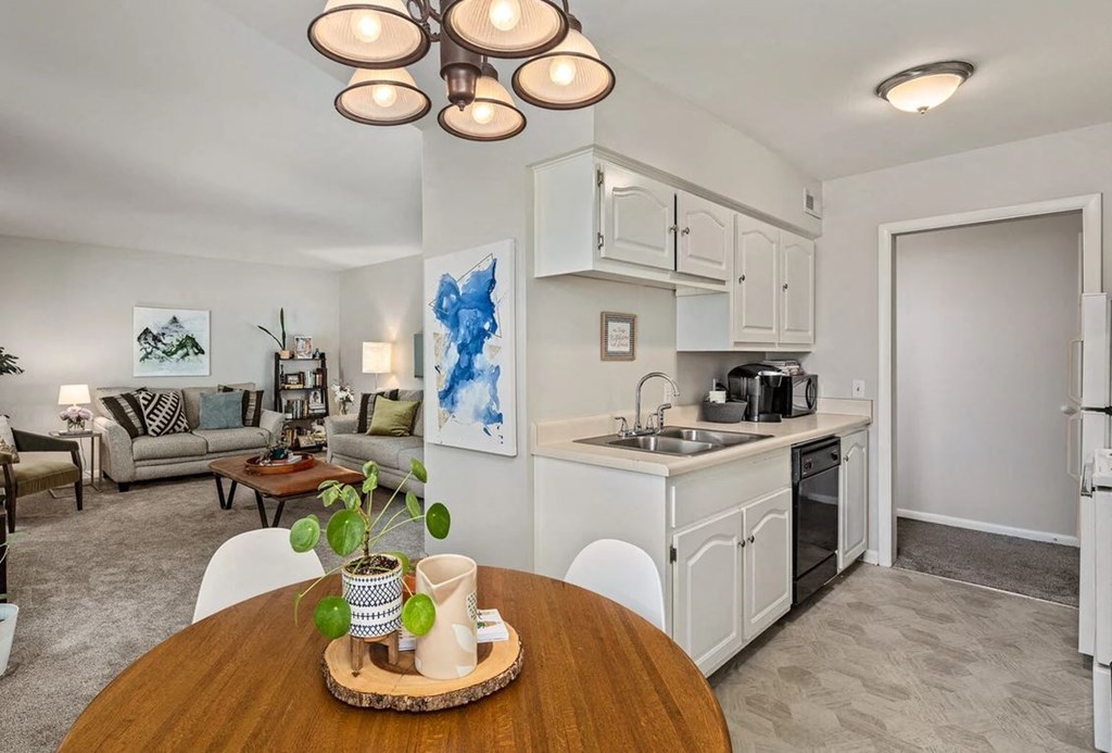 a kitchen and dining room with a table