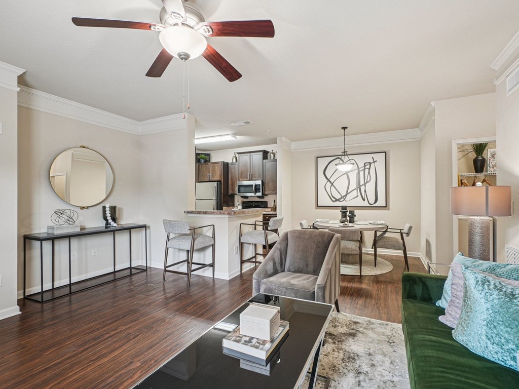 A living room with a green couch and a coffee table.
