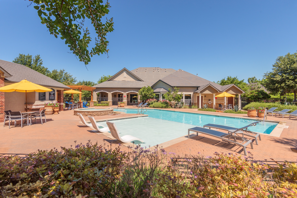 Pool, lounge chairs, and cabanas  at Parmer Place Apartments in Austin