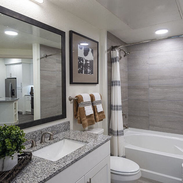 a bathroom with a shower and a toilet in it