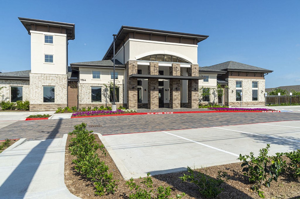 a rendering of a building with a parking lot