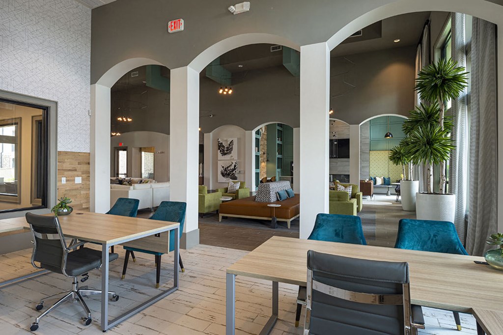 a dining room with tables and chairs in a lobby
