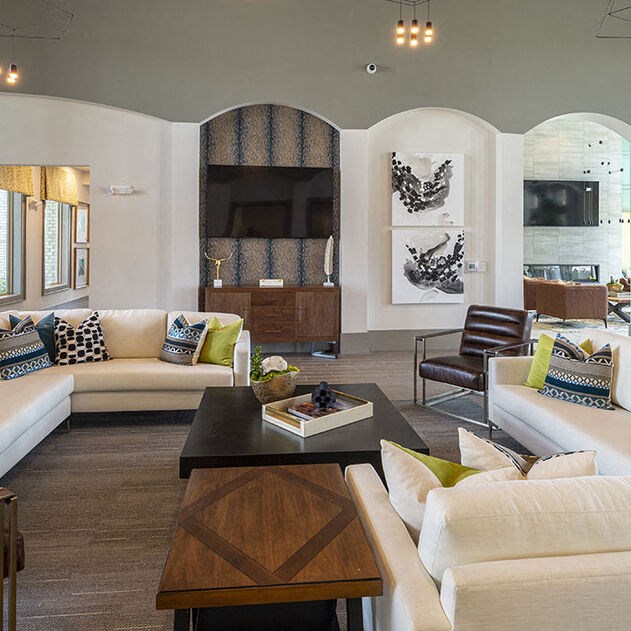 a living room with couches and a coffee table