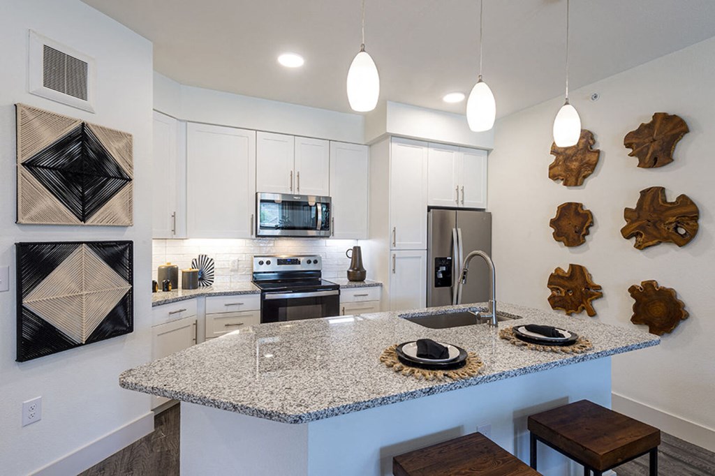 a kitchen with a granite counter top and a sink