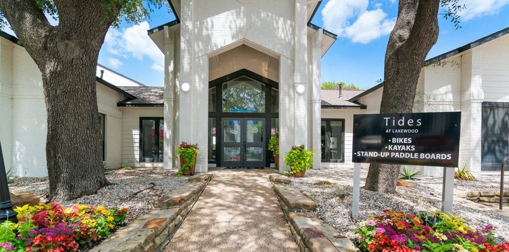 the entrance to a building with a sign in front of it