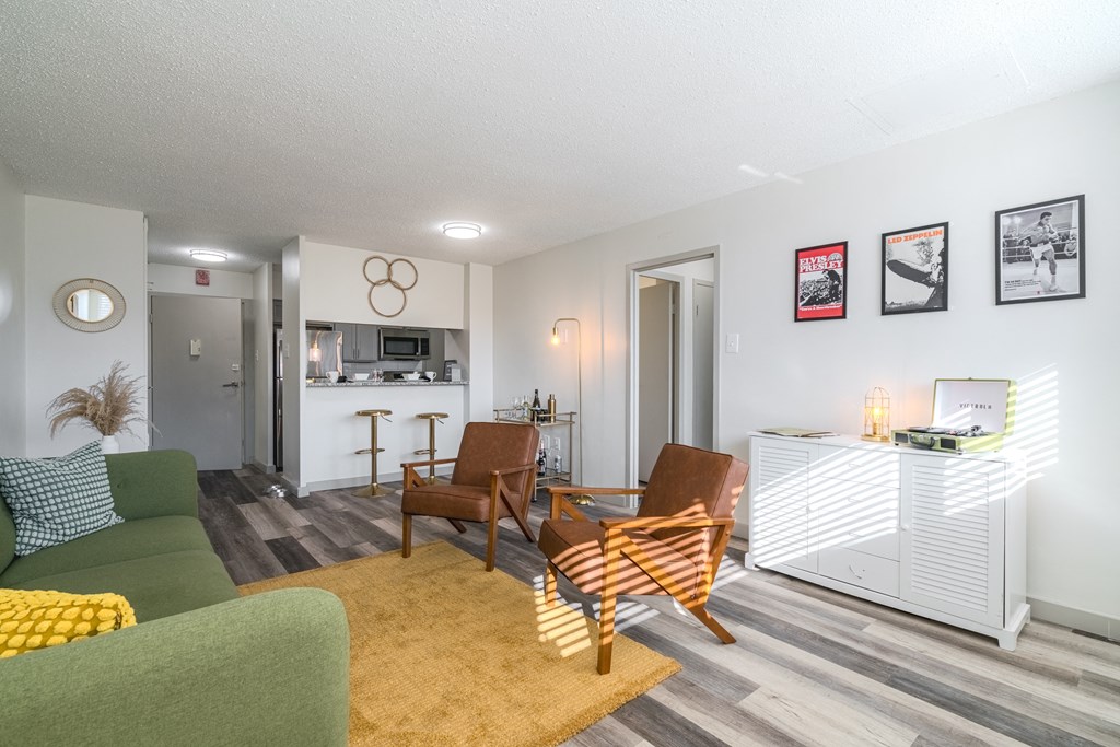 a living room with a couch and chairs