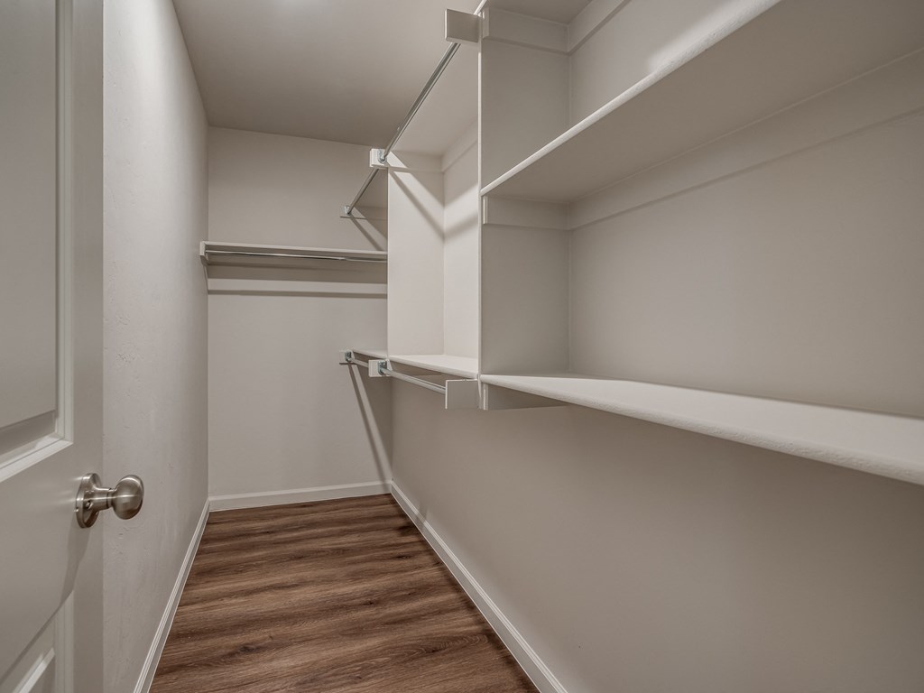a walk in closet in a 555 waverly unit