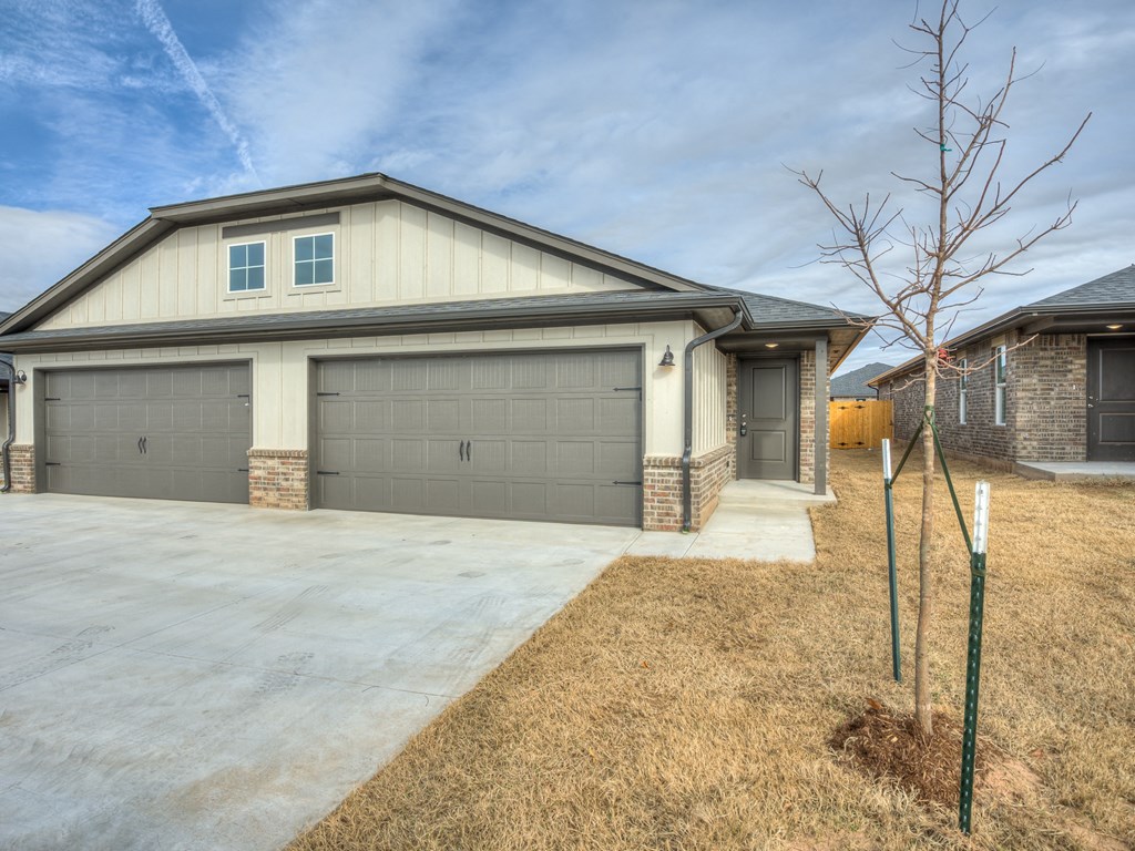 a home with a gray garage door