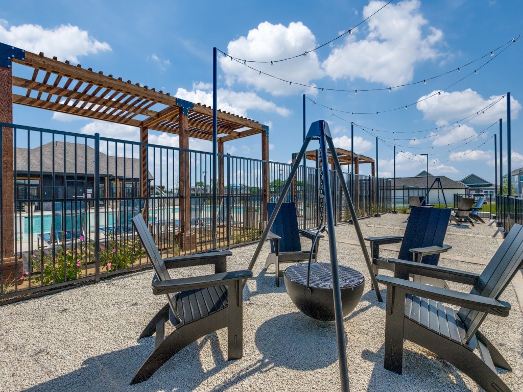 A sunny day at the outdoor seating area with chairs and a table.