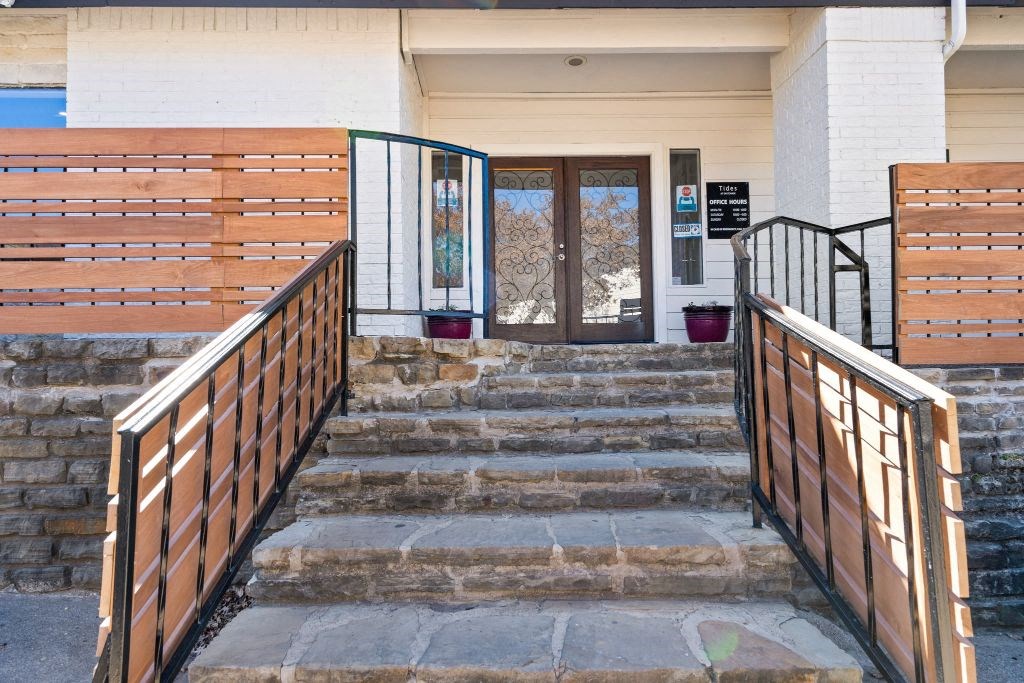 the stairs up to the entrance of a building