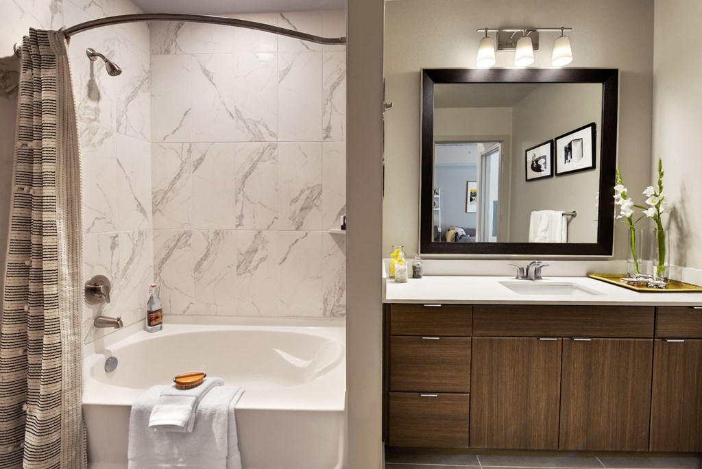 a bathroom with a bathtub and a sink