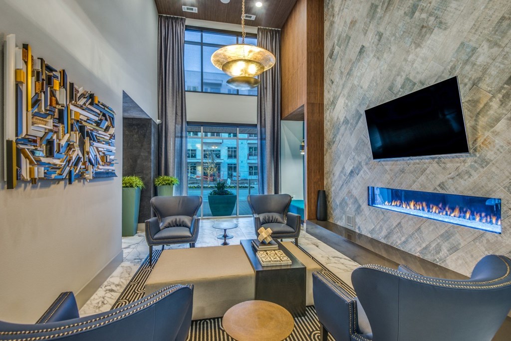 A modern living room with a television and a fireplace.