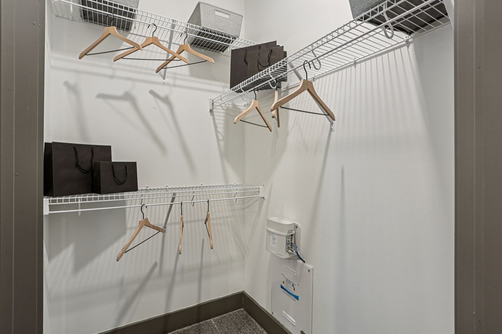 Closet with hangers and shelves.