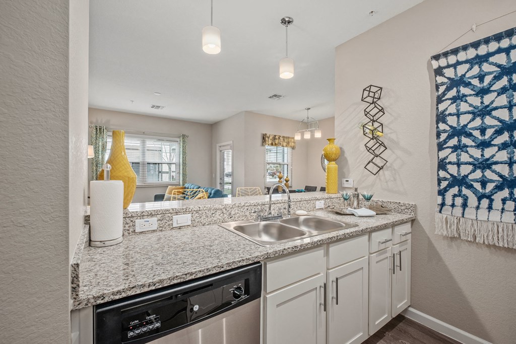 a kitchen with granite counter tops and a sink