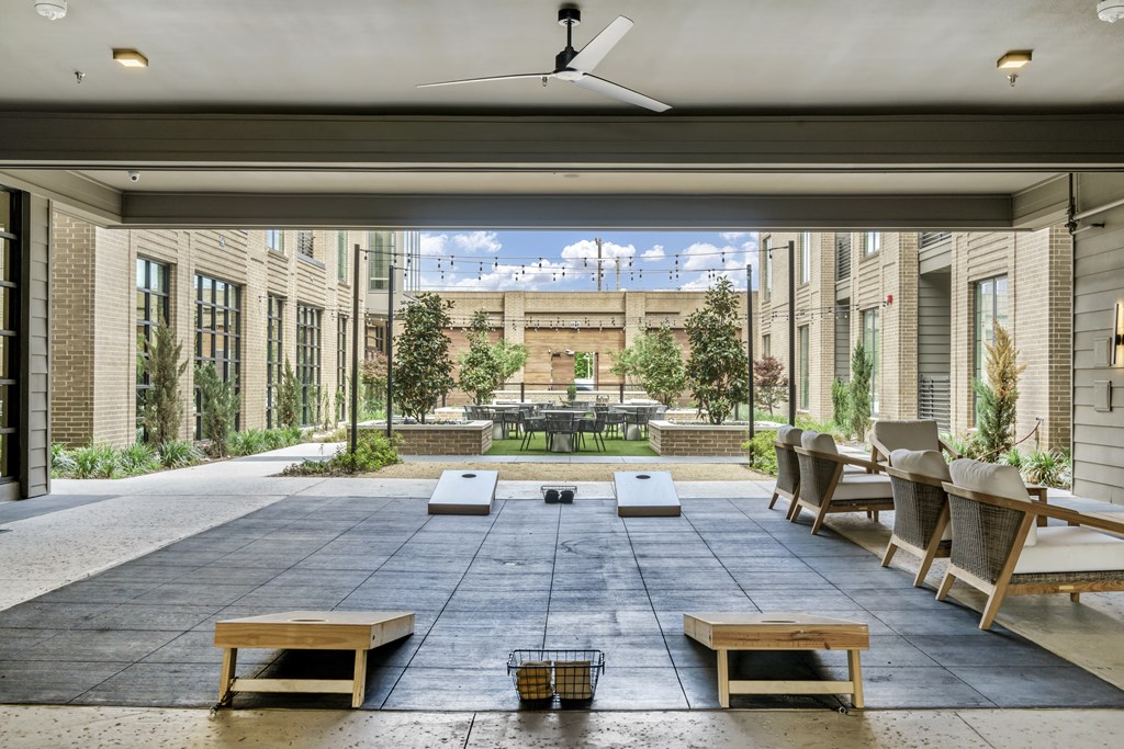 A patio with a table and chairs is shown.