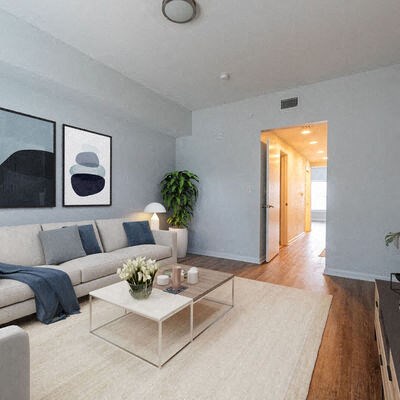 a living room with a white couch and a coffee table