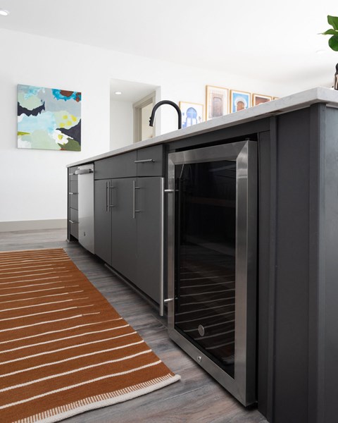 a kitchen with a refrigerator and an oven in it