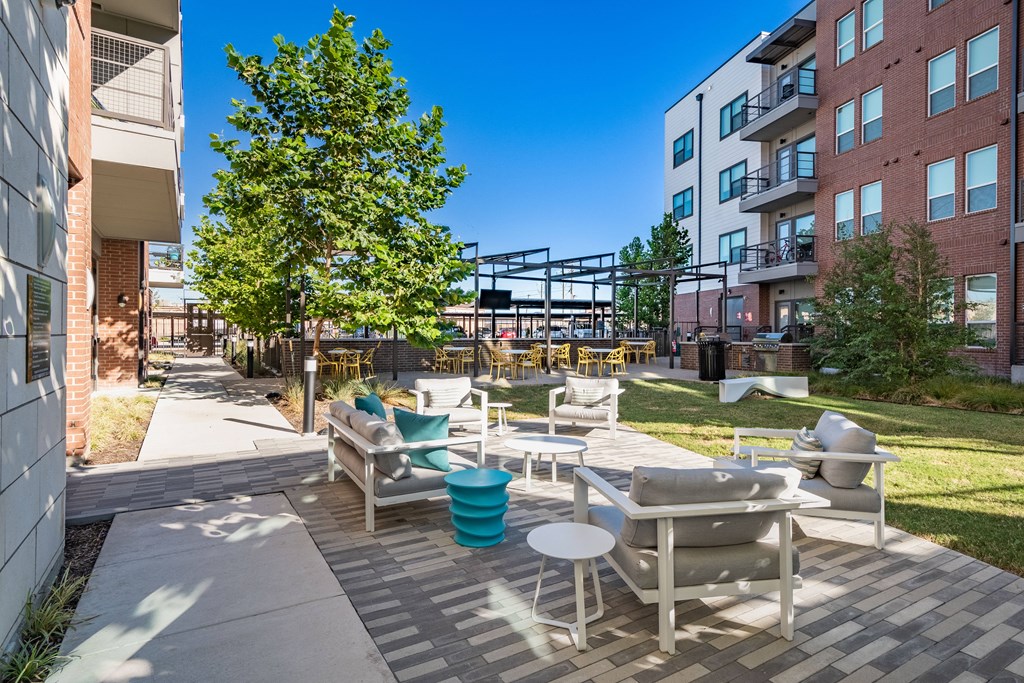 Outdoor Lounge Area and Tables with BBQ Grills