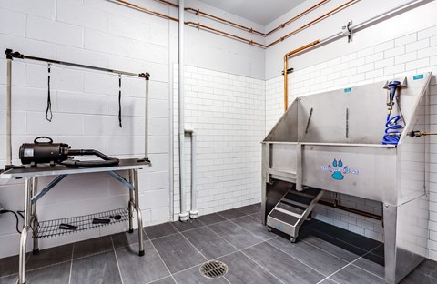 a kitchen with a stainless steel stove and a table