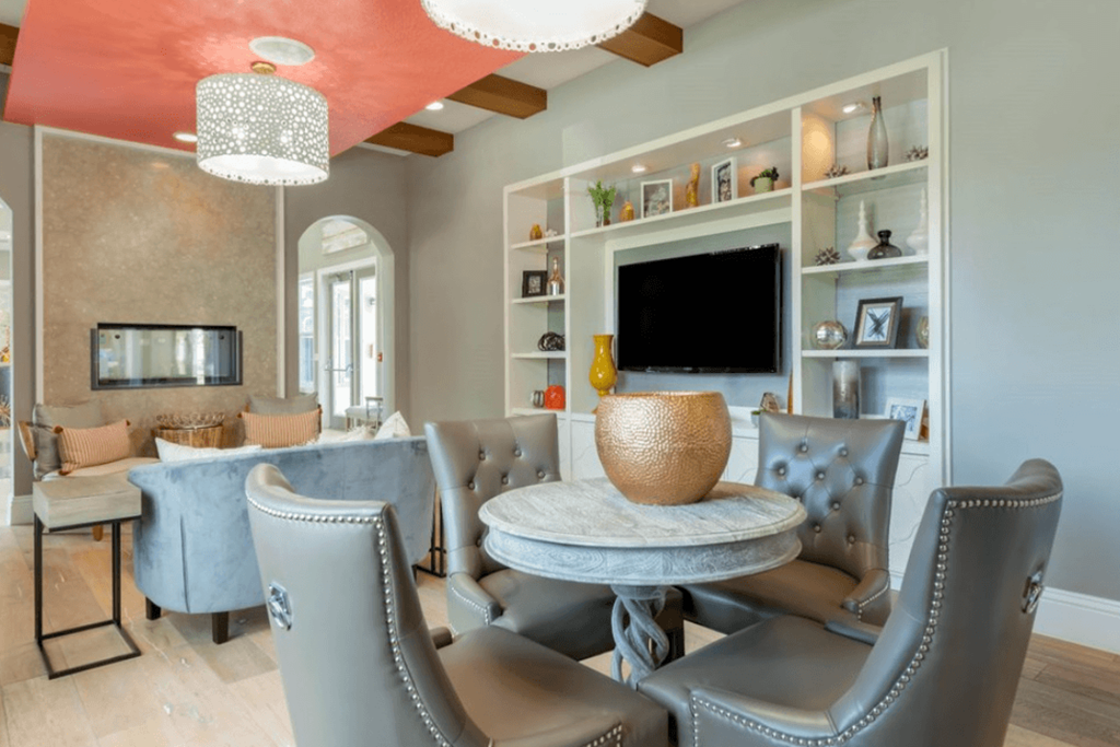 a living room with gray walls and a coral ceiling